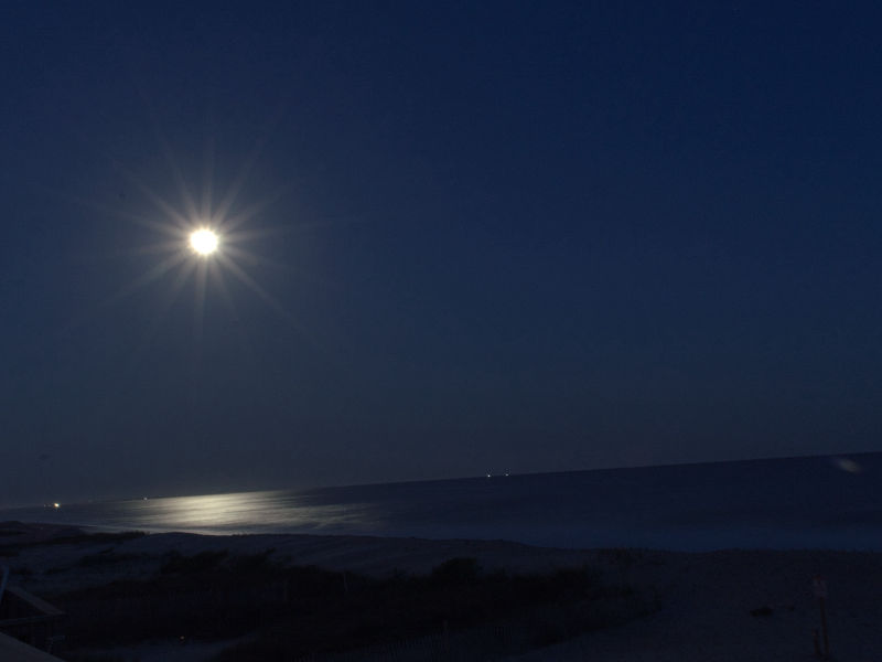 Bright supermoon over the coast