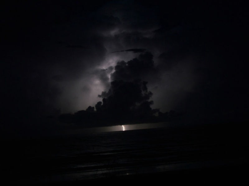 Lightning over the coastal horizon