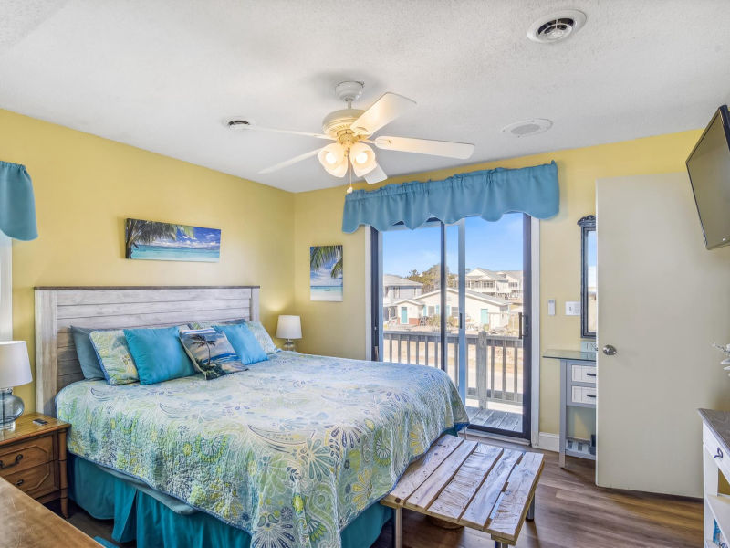 Primary bedroom with calm coastal styling
