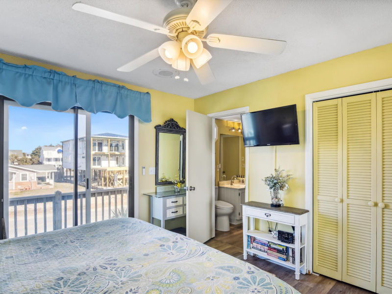Primary bedroom with windows toward ocean views