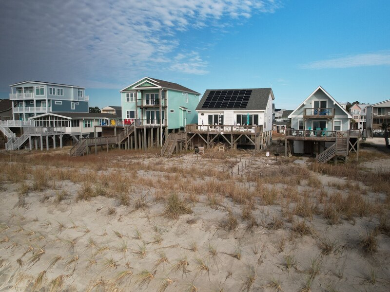 Aerial along the beachfront row of homes
