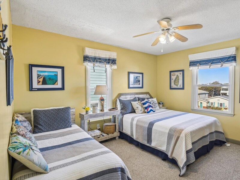 Upper-level bedroom with warm evening light