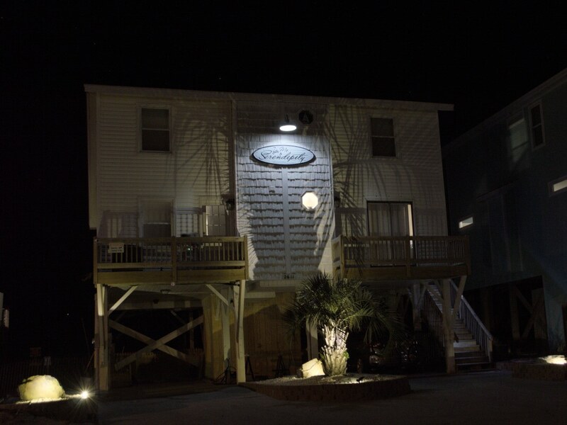 Warmly lit exterior entry at night