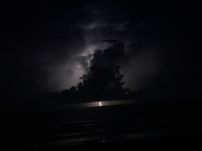 Third lightning composition over the ocean