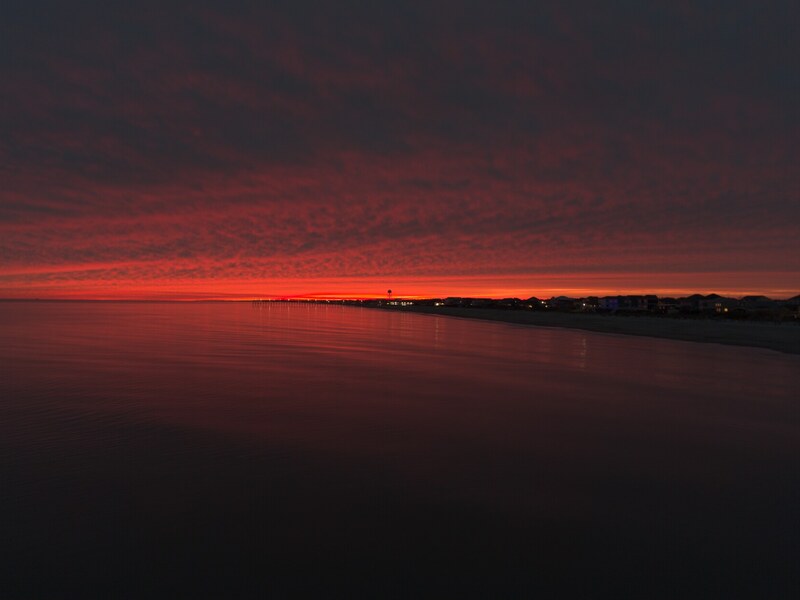 Vivid red sunset horizon over the coast