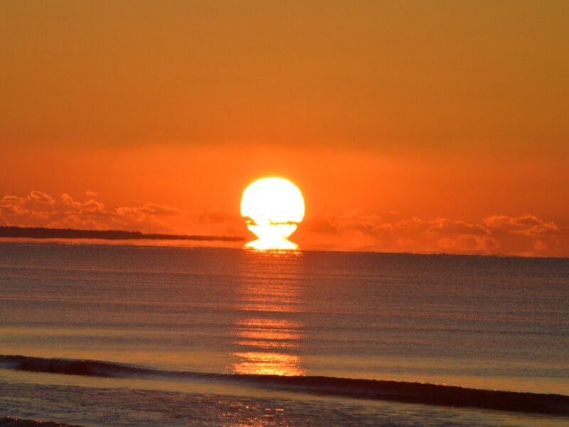 Solar disc sunrise over the ocean