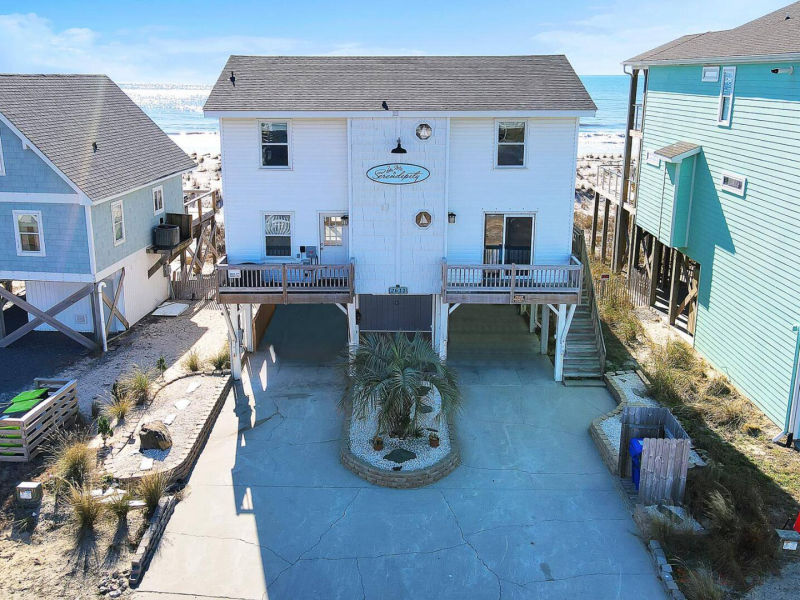 Centered exterior view of the elevated coastal home