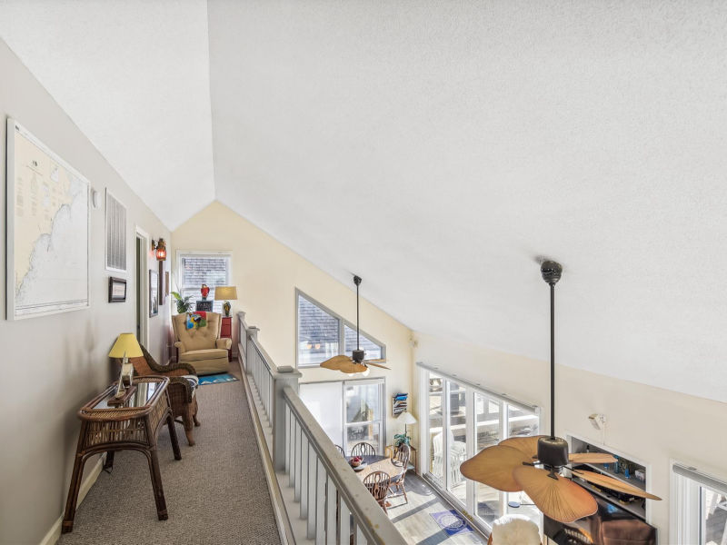 Upper-level walkway overlooking the living space